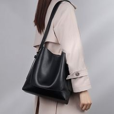 The Monique Genuine Leather Tote Bag is perfect for your daily commute, meetings, or shopping spree. This versatile bag features a closing with a magnetic buckle, shoulder strap, and inside pockets for easy organization. It has a roomy interior that will make your life easier. Now available in caramel, black, khaki, and white.