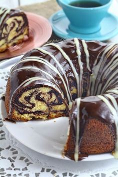 a bundt cake with chocolate icing on a plate