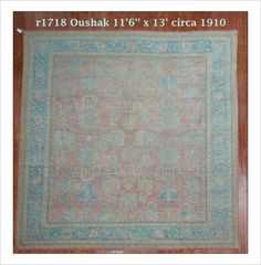 an antique rug with blue and pink colors