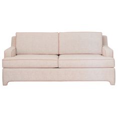 a white couch with a light pink upholstered back and arm rests against a white background