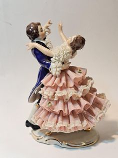 a figurine of a man and woman dancing