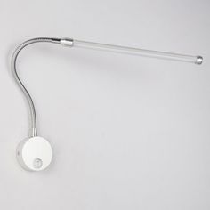 a white wall mounted light with a metal arm