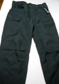 Brand new men's tactical/cargo pants.  Multiple pockets.  Black 100% polyester fabric.  Designed for men, but women could wear these, too.  The tag says "XL" but in reality they are "Large" at best.  Apparently they were mislabeled at the factory.  A great buy at only $30.00. Cargo Hose, Tactical Cargo Pants, Tactical Pants, New Man, Cargo Pants, Polyester Fabric, Porter, Gender Neutral, Bathing Beauties