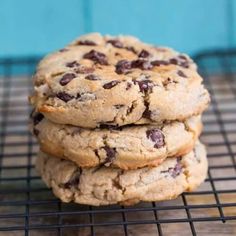 three cookies stacked on top of each other on a cooling rack with one cookie in the middle