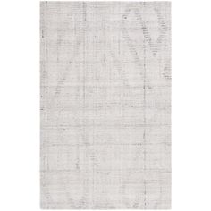 a white rug with an abstract design on the top and bottom corner, in grey tones