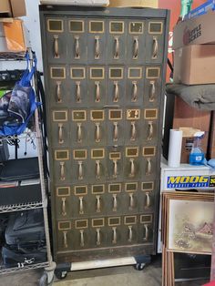 a large metal cabinet with many drawers