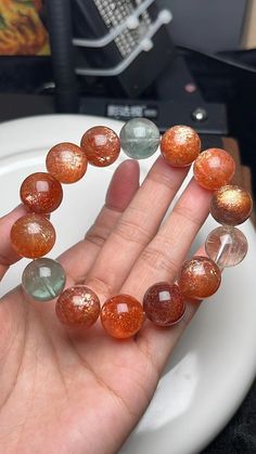 Material:  Arusha sunstone beads  size :  15.5mm hole size 1mm   quantity: one strand  6mm approx 29 pcs one strands 7mm approx25 pcs one strands 8mm approx 22 pcs one strands 9mm approx 21pcs one strands 10mm approx 19 pcs one strands 11mm approx 18pcs one strands 12mm approx 16 pcs one strands 13mm approx 16 pcs one strands 14mm approx 15 pcs one strands 15mm approx 14pcs one strands 16mm approx 14 pcs one strands 17mm approx 13pcs one strands 18mm approx 13pcs one strands 19mm approx 12pcs on Spiritual Orange Crystal Bracelet With Round Beads, Orange Gemstone Beaded Bracelets With Round Beads, Orange Gemstone Beaded Bracelets, Arusha, Amber Bracelet, Women Bracelet, Creative Jewelry, Beads Bracelet, Bracelet Jewelry