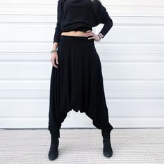 "Low-waist harem pants handmade from high quality cotton. Minimalist style. Black. This classy and elegant pair of harem pants is simply my everyday wear. Classic black color just goes well with everything. Whether I do my morning yoga routine or roam around the house running errands - this pant is just first thing i put on every morning. When the time comes to dress up and go out to dinner with friends in the city - again - this pair is my choice, i just style it with a fancy jacket or some asy Loosely Fitted Harem Pants For Fall, Lagenlook Relaxed Fit Ankle-length Harem Pants, Baggy Harem Bottoms For Fall, Lagenlook Ankle-length Relaxed Fit Harem Pants, Baggy Tapered Leg Harem Pants For Fall, Relaxed Fit Harem Bottoms For Fall, Loosely Fitted Harem Bottoms For Fall, Relaxed Fit Ankle-length Harem Pants In Lagenlook Style, Baggy Elastic Waistband Wide-leg Harem Pants