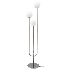 three light floor lamp with two white balls on each side and one black ball on the other