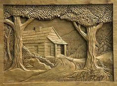 a wood carving depicting a cabin in the woods