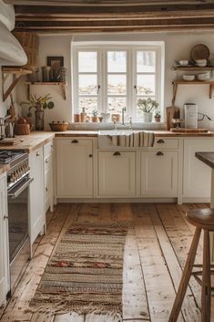 the kitchen is clean and ready for us to use it's natural wood flooring