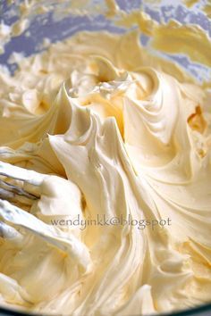 a mixing bowl filled with whipped cream