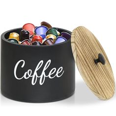 a black coffee canister filled with crayons