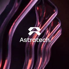 the logo for astrotech is displayed on an abstract glass sculpture in front of a black background