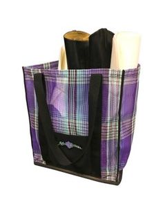 a purple and black plaid bag with two rolls of toilet paper in the bottom right corner