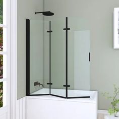 a bathroom with a corner shower and white walls