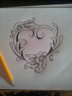 a pencil drawing of a heart with flowers and leaves on the side, next to a pencil