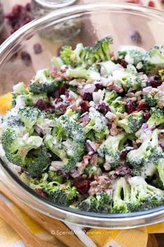 a bowl filled with broccoli and cranberry salad