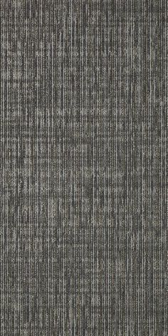 an up close shot of the texture of a carpet with grey and white stripes on it