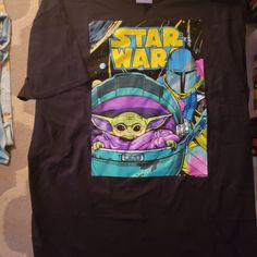 a star wars t - shirt with an image of baby yoda on it