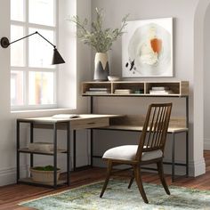 a chair and desk in a room with a rug on the floor next to it