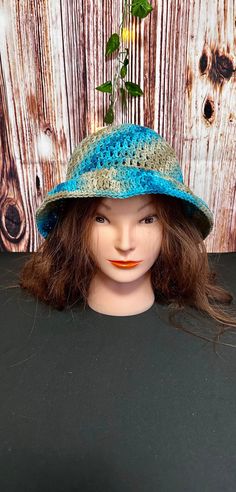 This beautiful bucket hat goes from blues to light blues also has some sand color. Reminds you of a day at the beach! Crocheted with 100% cotton yarn and is very lightweight. Stretchable fabric were one size fits most. Blue Summer Sun Hat For Festival, Blue Bucket Hat With Curved Brim For Festivals, Blue Curved Brim Bucket Hat For Festival, Blue Wide Brim Bucket Hat For Festivals, Cotton Crochet Beach Hat With Short Brim, Beach Crochet Cotton Hat With Short Brim, Blue Short Brim Bucket Hat For Festivals, Blue Bucket Hat With Short Brim For Festivals, Brimmed Cotton Crochet Hat For Beach