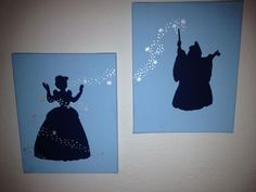 two silhouettes of princess and prince on blue paper