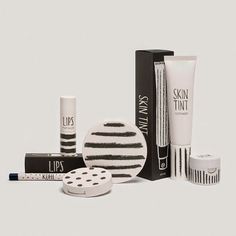 various skin care products are displayed on a white background with black and white stripes in the middle