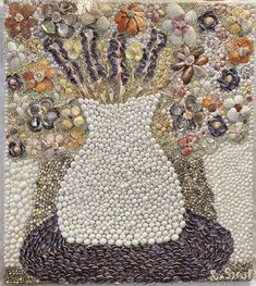 a mosaic with shells and flowers in it