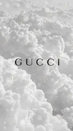 the word gucci is surrounded by clouds