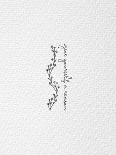 the letter i is written in black ink on white paper with an artistic floral design