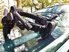 a car with a pair of headphones attached to the windshield and on top of it