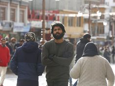 a group of people walking down a street