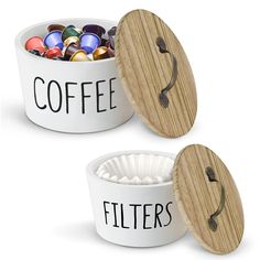 two white ceramic bowls with wooden lids filled with balls and coffee filters, one has a round lid that says coffee filters