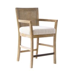 the arm chair is made from wood and has a white upholstered cushion on it