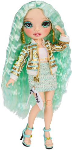 a doll with green hair and blue eyes wearing a gold - tone jacket, white dress and high heels