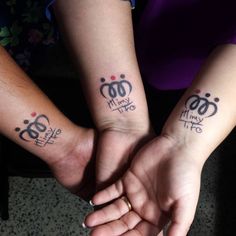 two people with matching tattoos on their arms