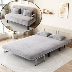 an image of a bed with pillows on it and a couch in the corner next to it