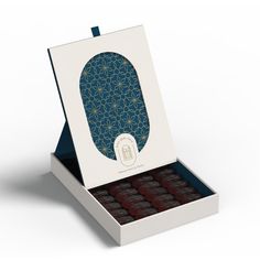 an open box of chocolates on a white background