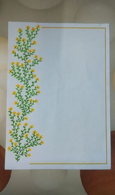 a white card with yellow flowers on it