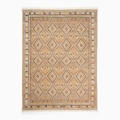 an antique rug with diamonds and fringes on the bottom, in beige tones against a white background