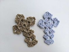 three crochet designs are shown on a white surface, one is blue and the other is brown