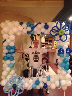 a man standing in front of a balloon frame