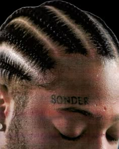 a man's head with the word wonder written on his forehead and undercut