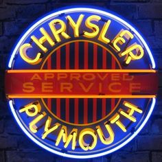 a neon sign on the side of a brick wall that says chrysler service plymouth in yellow and red