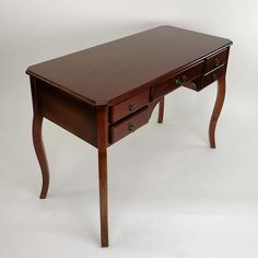 a wooden desk with two drawers on one side and an open drawer on the other