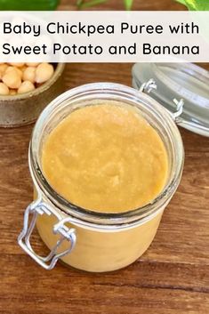 baby chickpea puree with sweet potato and banana in a glass jar on a wooden table