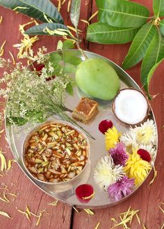 there is a plate with food on it and the words advance happy ugadi