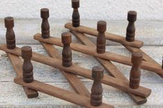 several wooden pegs are lined up on the ground