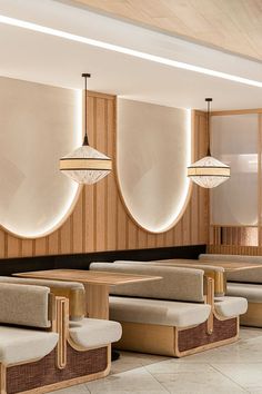 the interior of a restaurant with wooden booths